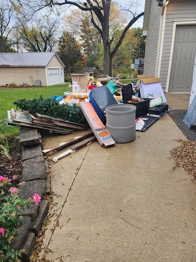Dumpster being loaded with debris for 3 Yard Dumpster Rental in Marietta